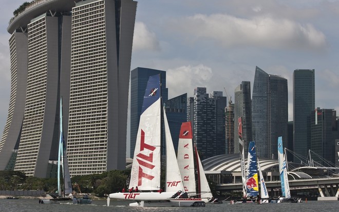 Team TILT flying a hull in front of the fleet in Marina Bay - Act 9 Day 4 Extreme Sailing Series 2011 © Lloyd Images http://lloydimagesgallery.photoshelter.com/